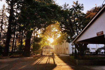 christian boarding school, late afternoon sunshine, main campus area